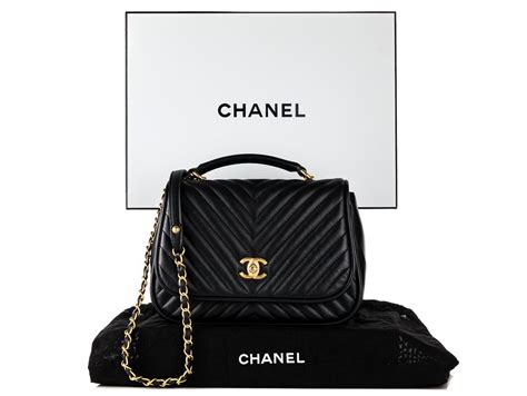 chanel reversed chevron round flap bag